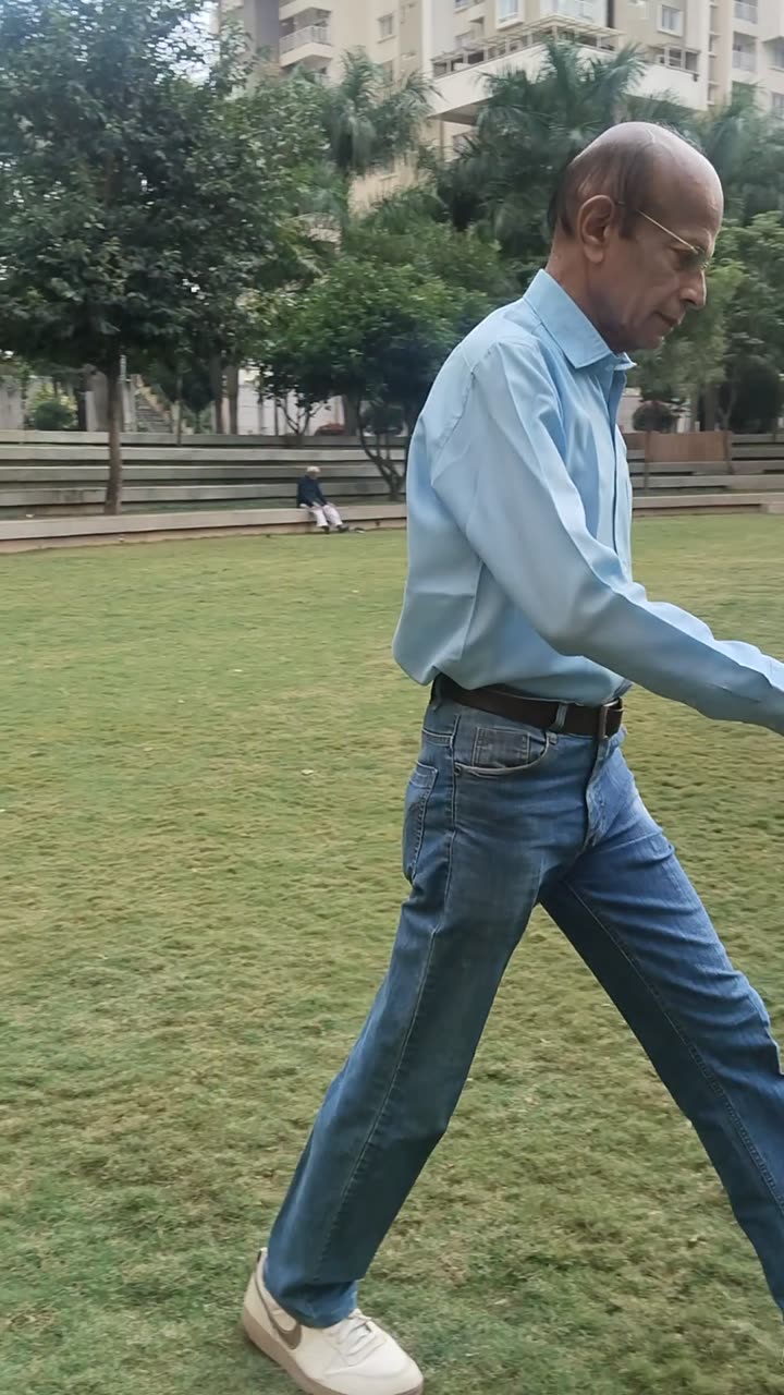 Close profile, mid-stride, crossing the lawn.